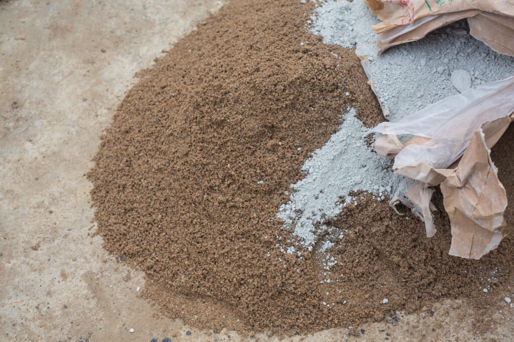 Construction technicians are mixing cement stone sand construction 1024x683